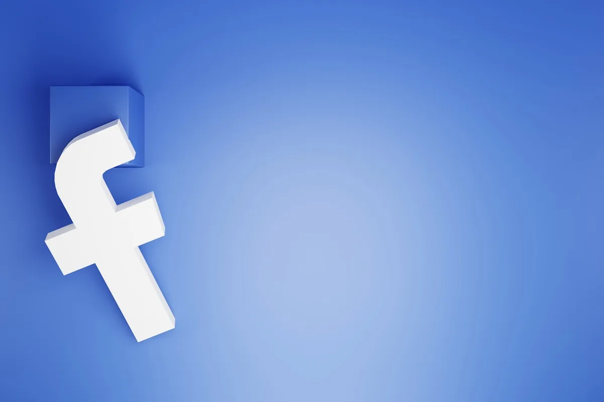Le logo Facebook en 3D sur fond bleu